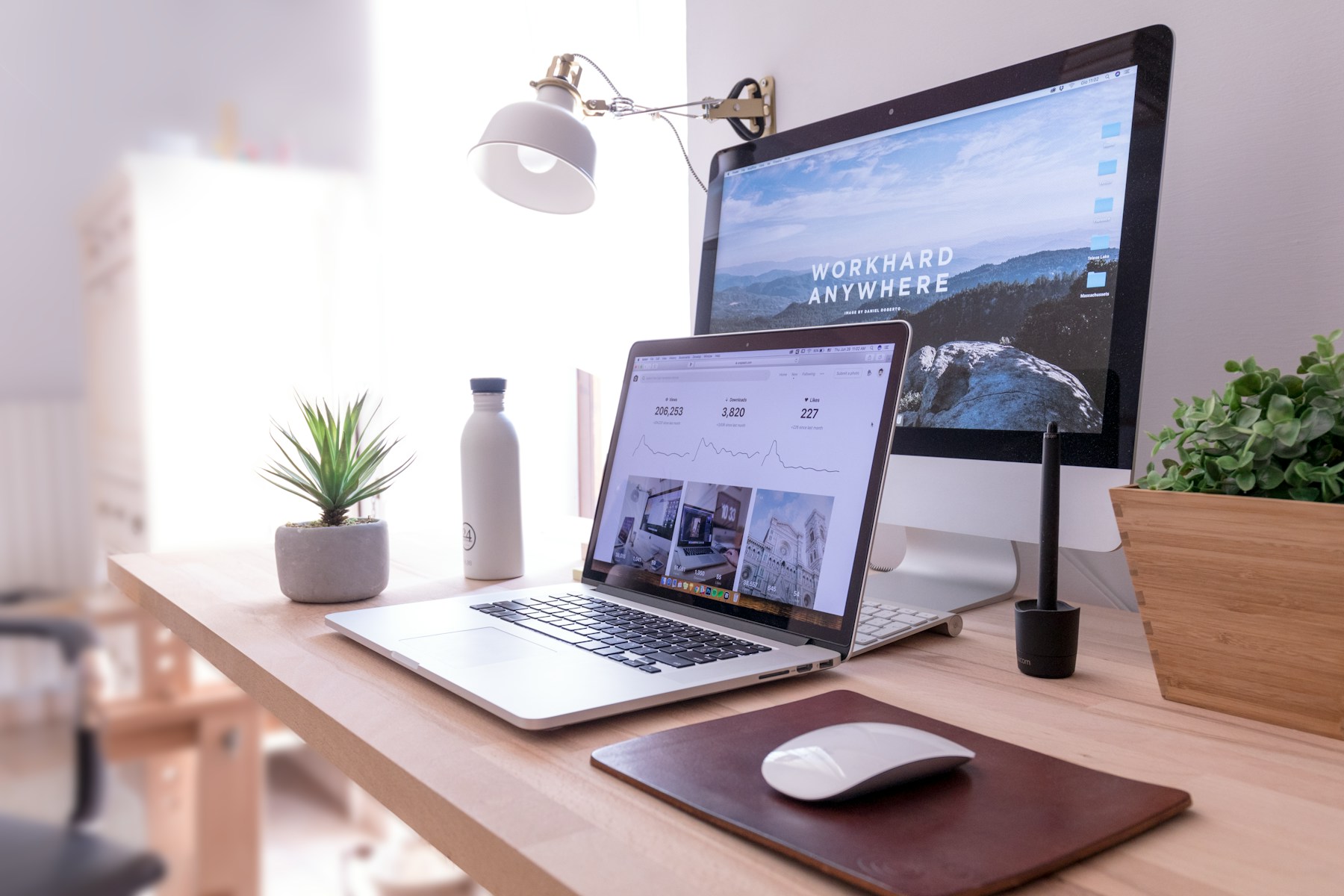 A website open on a laptop and a monitor